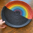 Handmade rainbow woven tray basket by Ange Muhorakeye