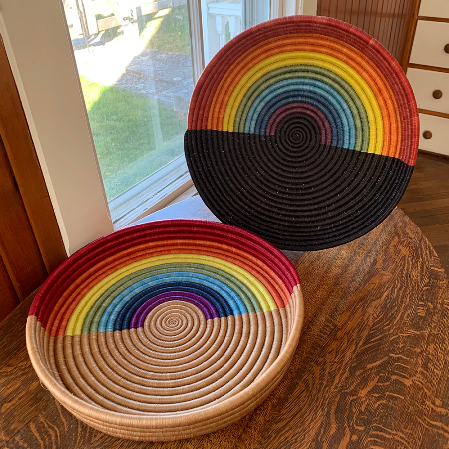 Handmade rainbow woven tray baskets by Ange Muhorakeye